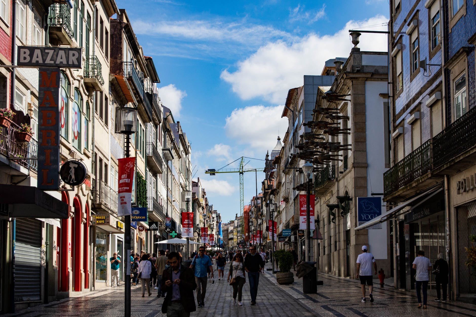 photo of people walking on street near buildings